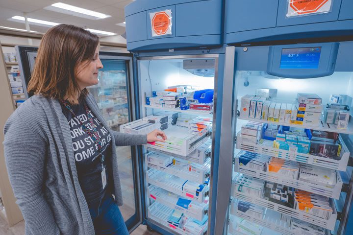 Patient picking up medicine at the pharmacy