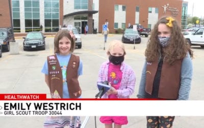 Local girl scouts donate cookies to Siouxland Community Health Center