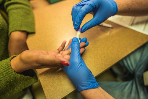 Image of a woman getting tested for HIV